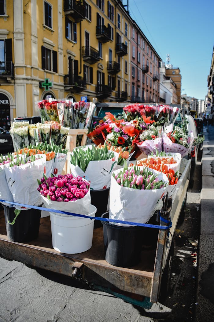 Bustling flower market with vibrant bouquets in Milan's lively streets.